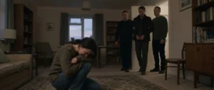 Drama series scene showing a woman collapsed in grief while the man she loves is taken away in handcuffs