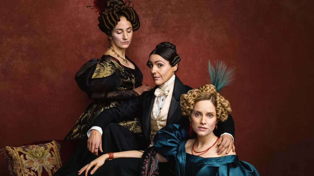 Suranne Jones as Anne Lister walking through Halifax in Gentleman Jack