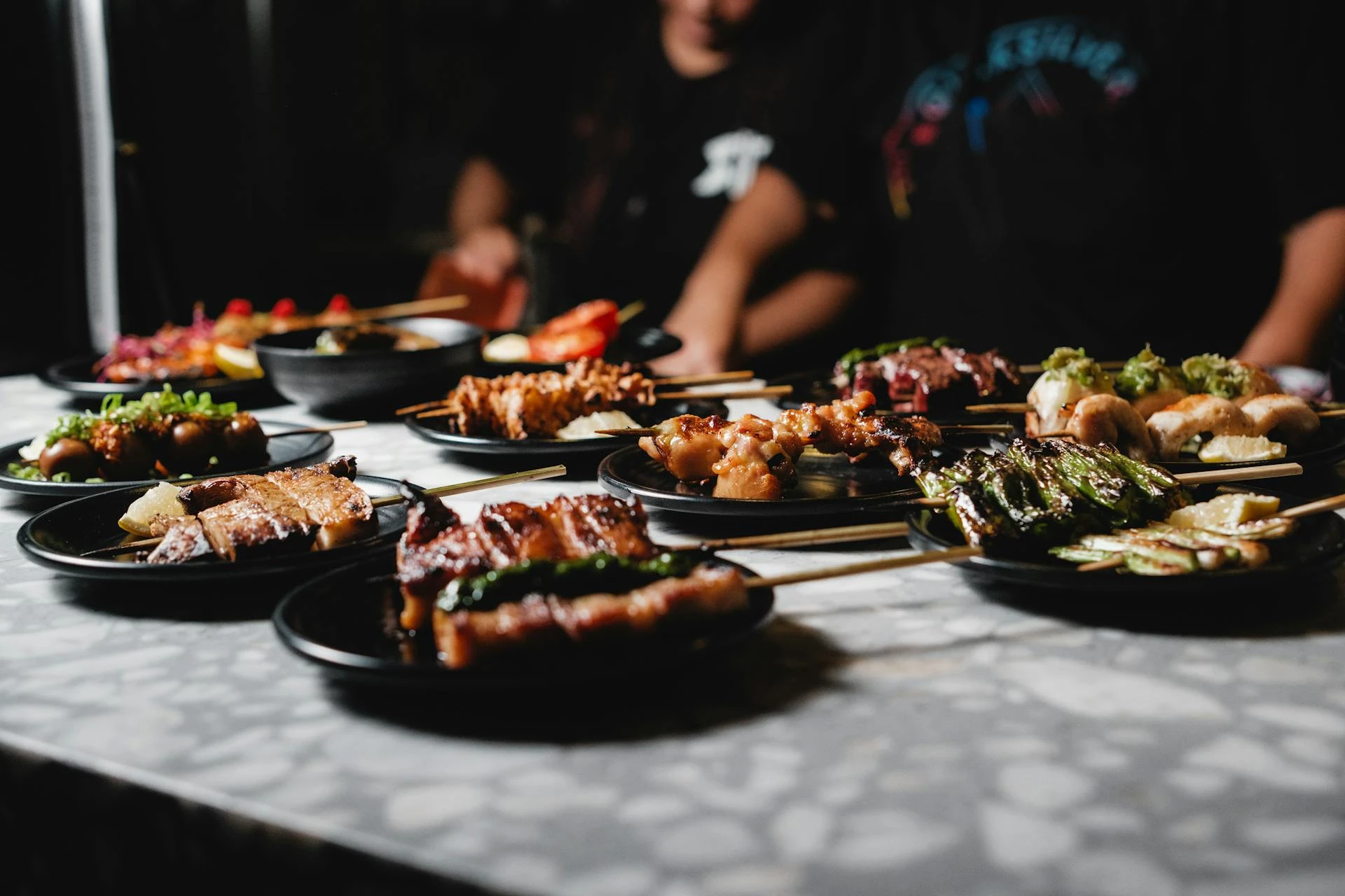Izakaya dinner spread with yakitori and beer in Osaka