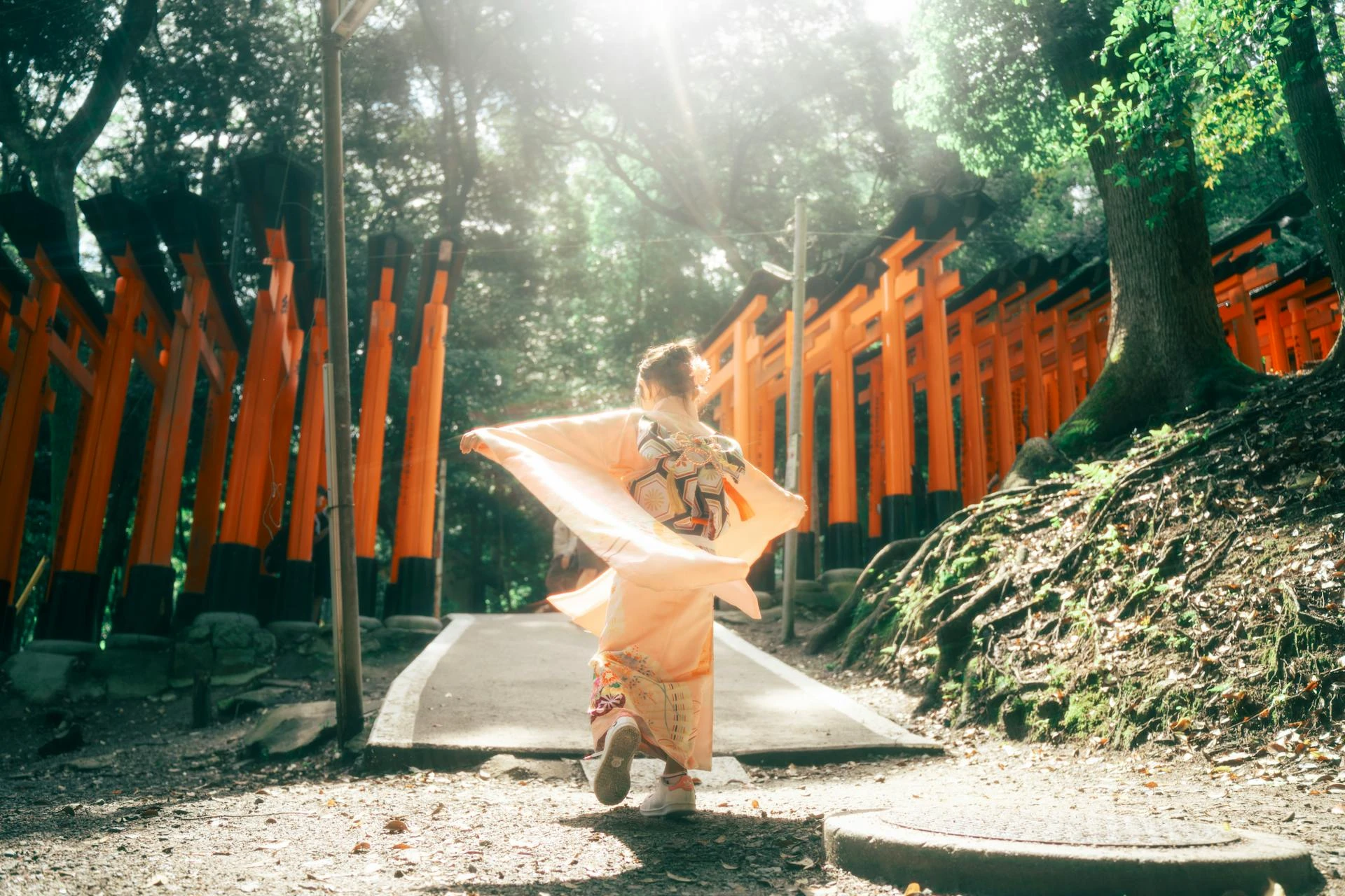 Fushimi Inari torii gates path in Kyoto at sunrise